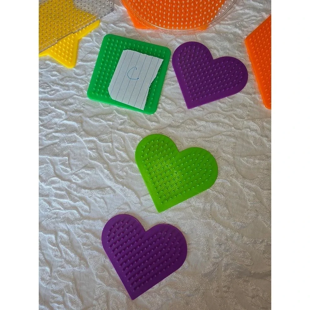 Lot C Perler bead pegboards in various shapes and bright colors